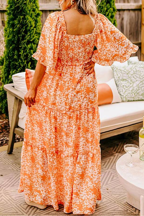 Jimena® | Oranje gesmokte maxi-jurk met bloemenprint, V-hals en klokmouwen