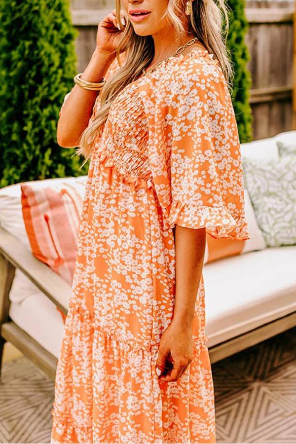 Jimena® | Oranje gesmokte maxi-jurk met bloemenprint, V-hals en klokmouwen